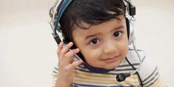 Toddler with headphones on
