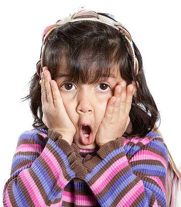 Surprised girl with her hands on her face